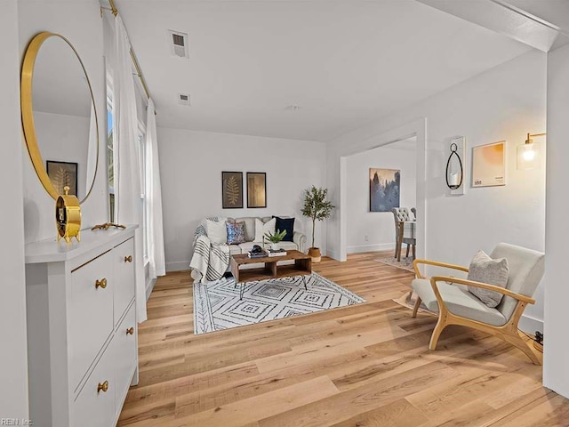 sitting room featuring light hardwood / wood-style floors