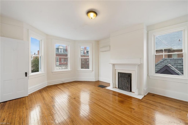 unfurnished living room featuring hardwood / wood-style floors