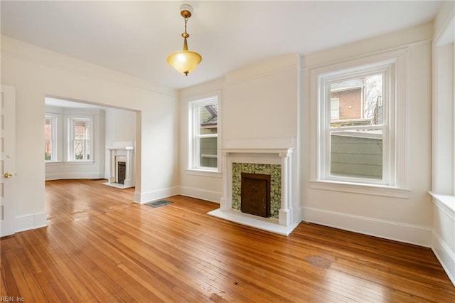 unfurnished living room featuring wood-type flooring