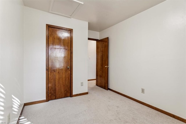 unfurnished bedroom featuring light colored carpet