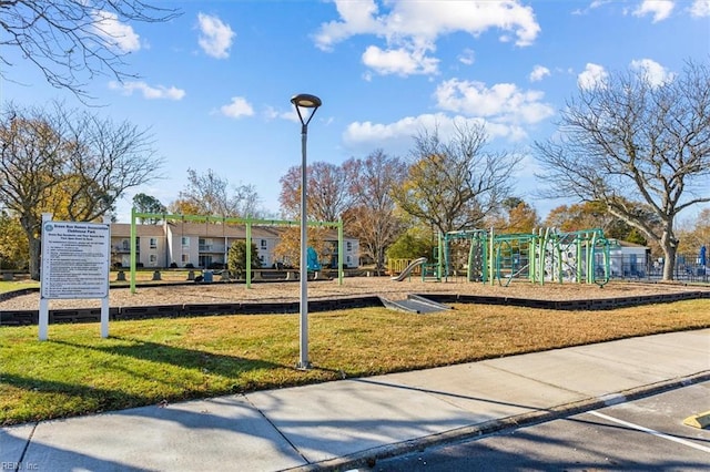 view of playground featuring a lawn