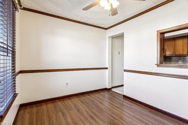 unfurnished room featuring ceiling fan, ornamental molding, and wood-type flooring