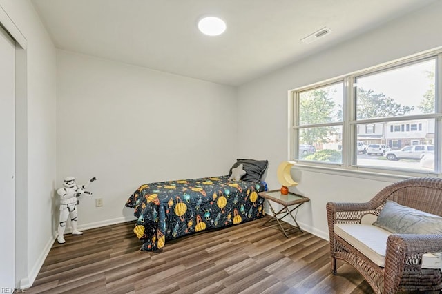 bedroom with hardwood / wood-style floors