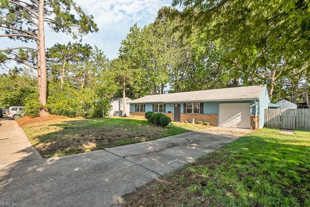 ranch-style house with a garage and a front yard