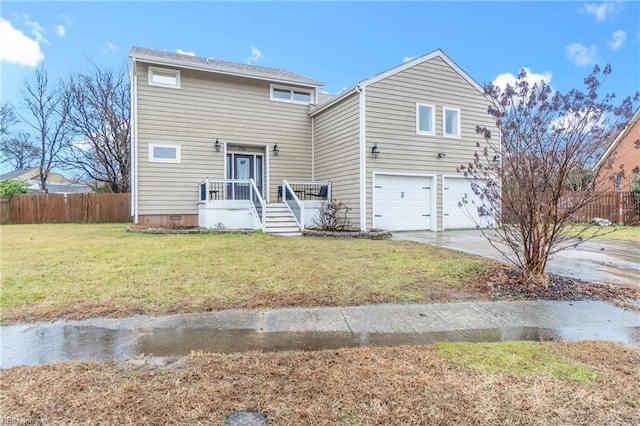 view of front of house with a garage and a front lawn