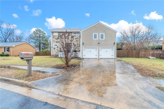 view of front of home with a garage and a front yard