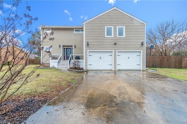 view of front of house featuring a garage and a front yard