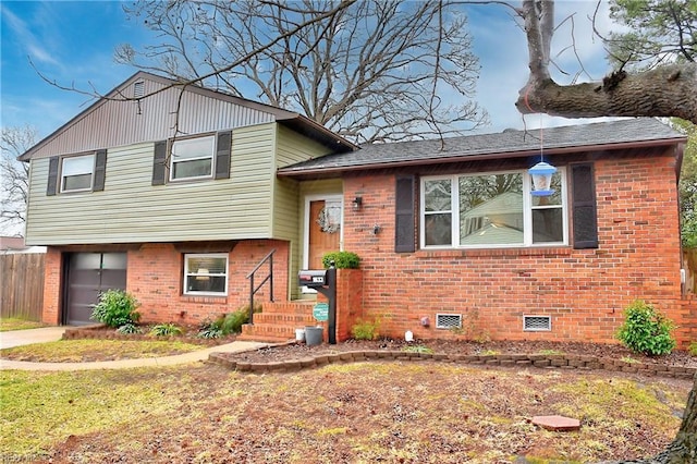 split level home featuring a garage