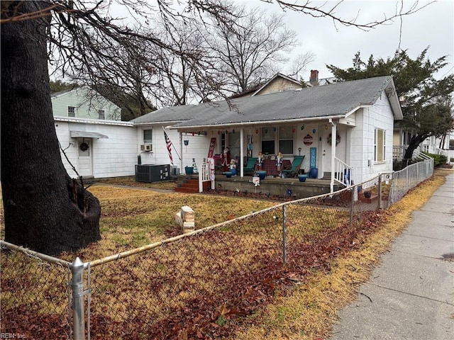 view of front facade featuring covered porch and cooling unit