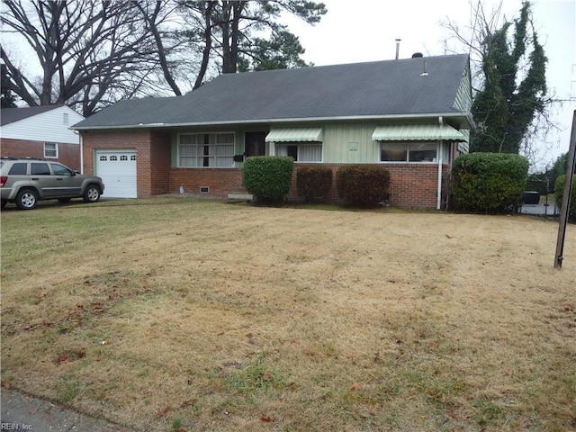 single story home with a garage and a front lawn