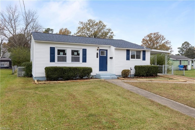 ranch-style house featuring central AC and a front lawn