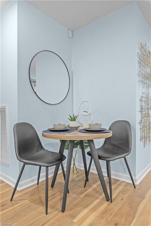 dining room with light wood-type flooring