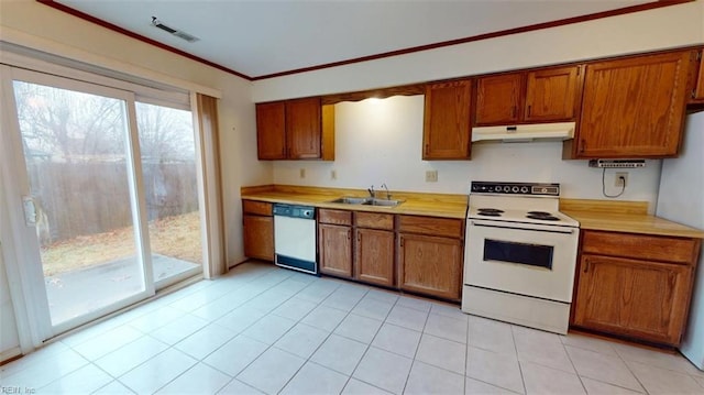 kitchen featuring under cabinet range hood, white appliances, a sink, light countertops, and brown cabinetry