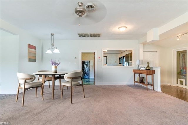 view of carpeted dining space