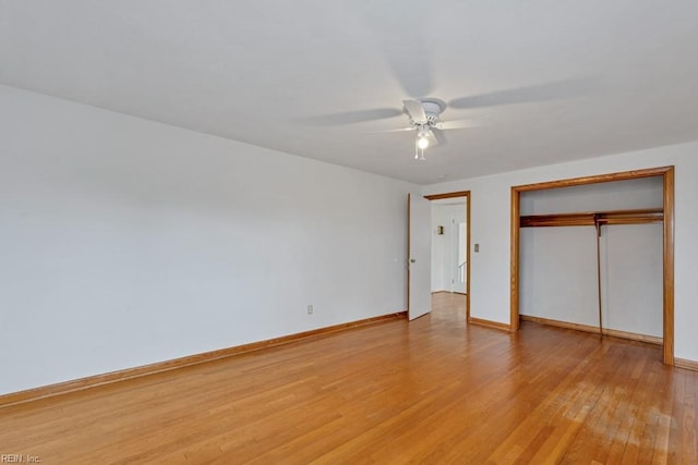 unfurnished bedroom with a closet, ceiling fan, and light hardwood / wood-style flooring