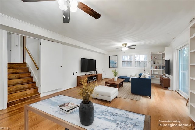 living room with ceiling fan and light hardwood / wood-style floors