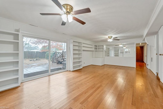 unfurnished living room with hardwood / wood-style flooring, built in features, and ceiling fan