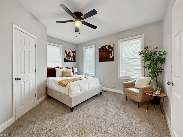 bedroom featuring ceiling fan and light colored carpet