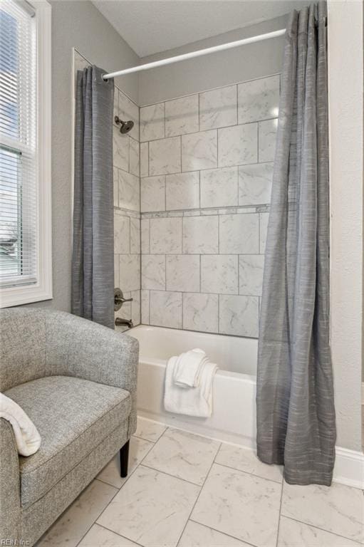 bathroom featuring shower / bath combination with curtain