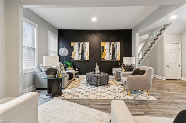 sitting room with wood-type flooring