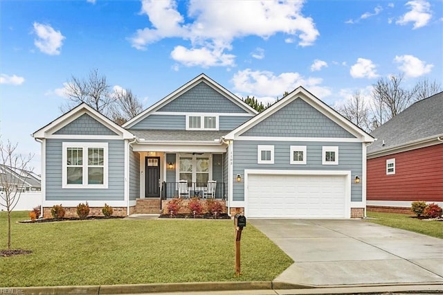 craftsman-style house featuring a garage, a front yard, and covered porch