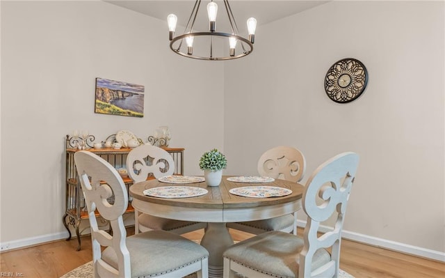 dining room featuring a chandelier and light hardwood / wood-style floors