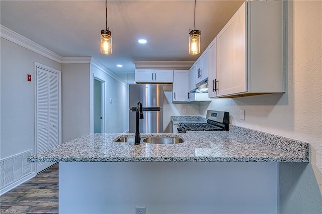 kitchen with white cabinetry, stainless steel appliances, kitchen peninsula, and hanging light fixtures