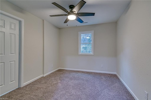 carpeted empty room with ceiling fan