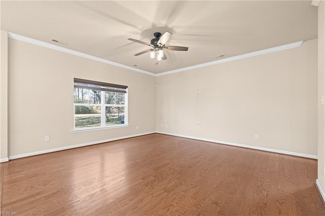 unfurnished room featuring hardwood / wood-style flooring, ornamental molding, and ceiling fan