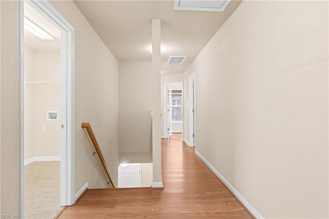 hall with hardwood / wood-style floors