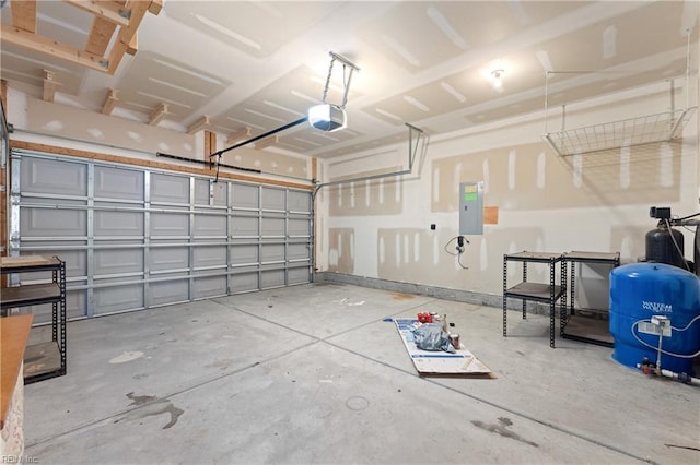 garage featuring a garage door opener and electric panel