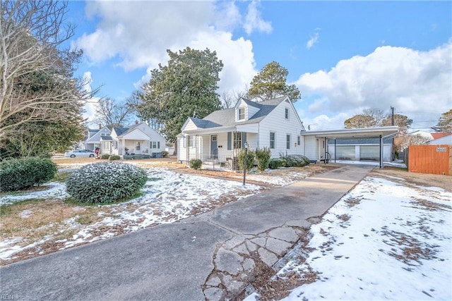 view of front of home featuring a carport and covered porch