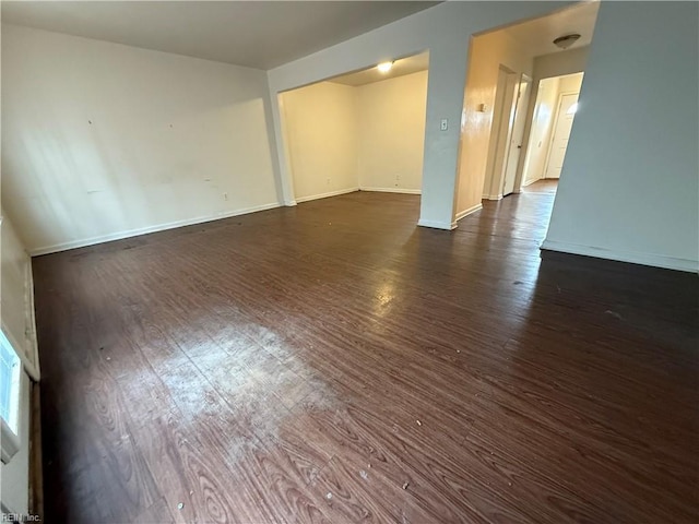 spare room featuring dark hardwood / wood-style floors