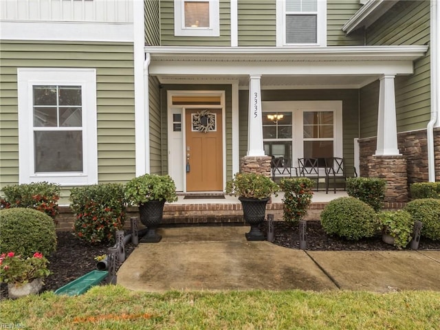 property entrance with covered porch