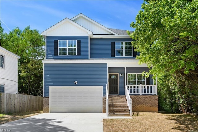 view of front of property featuring a garage and a porch