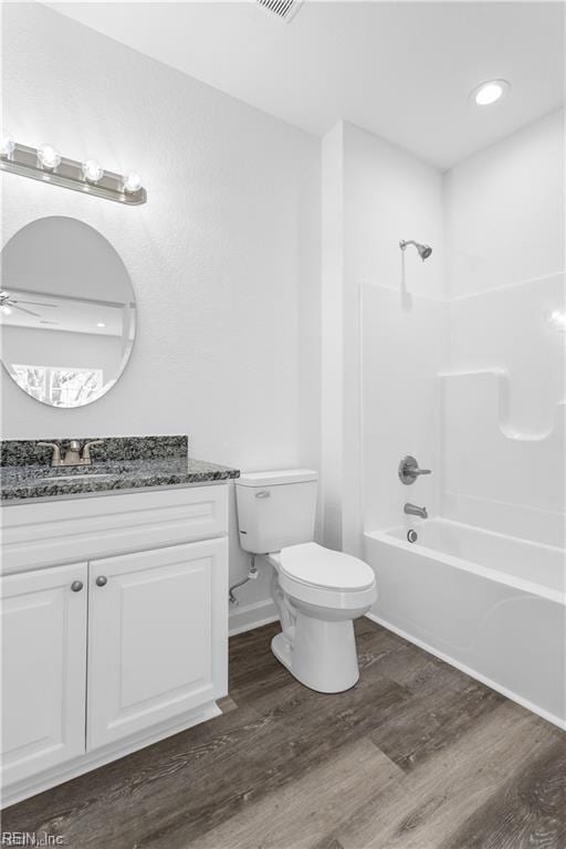 236 Buxton Ave, Newport News, VA 23607 - full bathroom featuring hardwood / wood-style flooring, ceiling fan, shower / bathing tub combination, vanity, and toilet