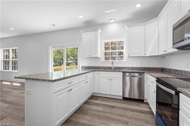 236 Buxton Ave, Newport News, VA 23607 - kitchen with stainless steel appliances, sink, and white cabinets