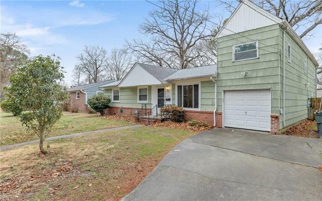 view of front of home featuring a garage and a front lawn