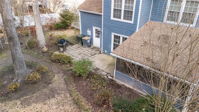 view of side of home with a patio area