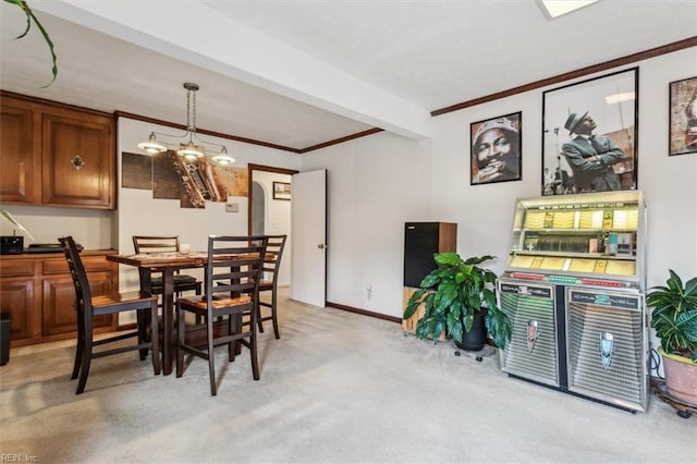 carpeted dining area with crown molding