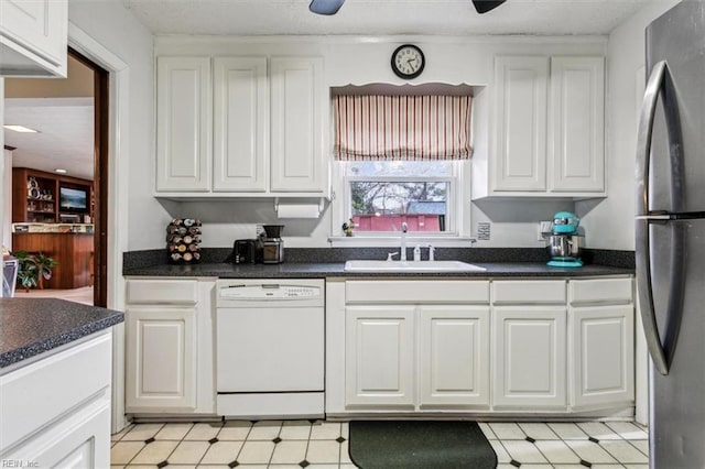 kitchen featuring white cabinetry, stainless steel fridge, and dishwasher