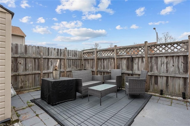 view of patio / terrace with a wooden deck and an outdoor hangout area