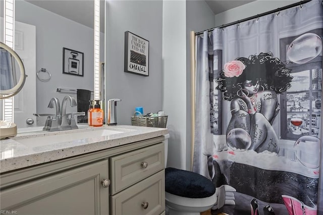 bathroom with vanity and toilet