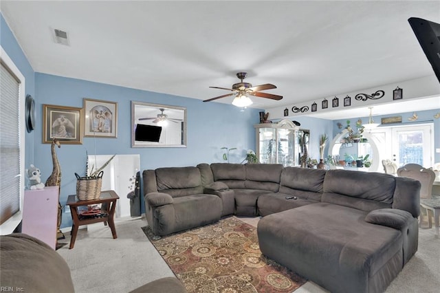 living room with ceiling fan and light carpet