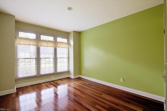 empty room featuring hardwood / wood-style flooring