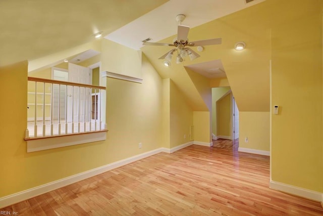 bonus room featuring ceiling fan, vaulted ceiling, and light hardwood / wood-style flooring