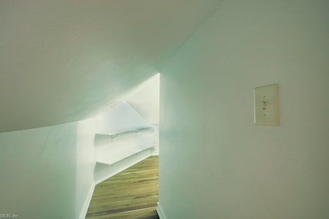 interior space featuring light hardwood / wood-style flooring and vaulted ceiling