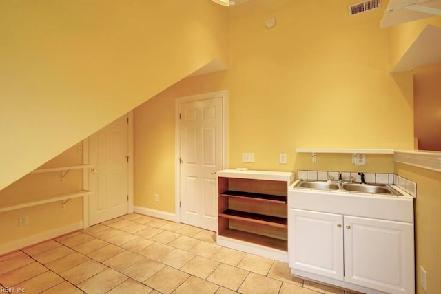 interior space with tile patterned flooring and sink