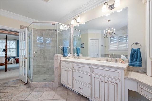 bathroom with crown molding, plenty of natural light, a sink, and ensuite bath