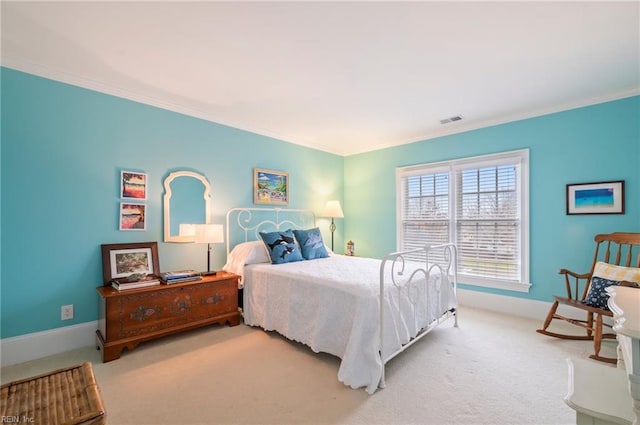 bedroom featuring baseboards, visible vents, crown molding, and light colored carpet